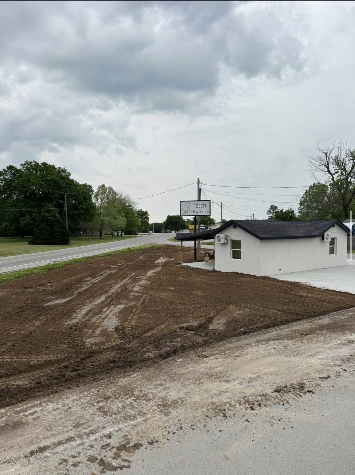 Bare dirt lot before sod installation